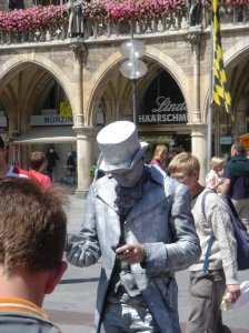 Like everyone else, living statues need to keep in touch. 