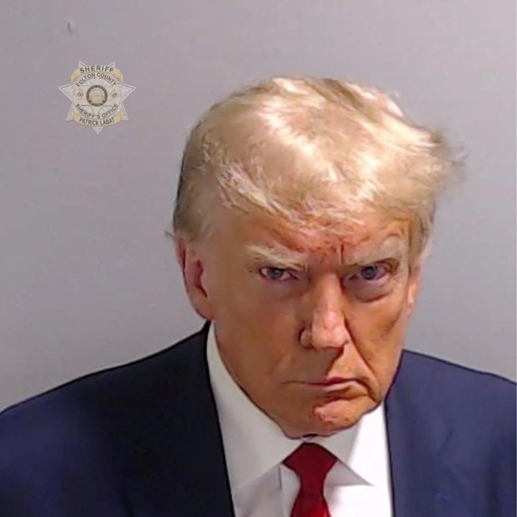 This image has an empty alt attribute; its file name is trump-mugshot-final.jpg.webp